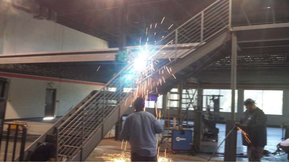 PEC Welder working on Structural Steel Staircase