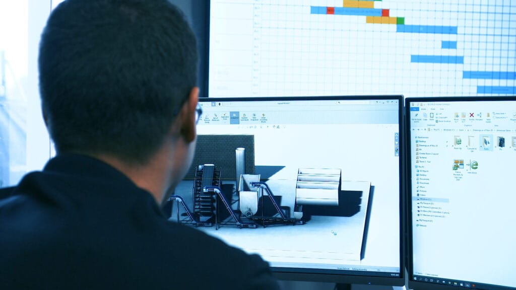 PEC specialist working at computer screen with Statistical Process Control information
